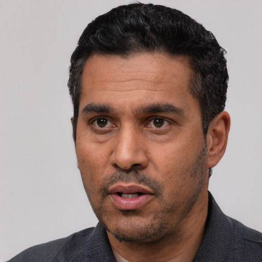 Neutral white adult male with short  black hair and brown eyes