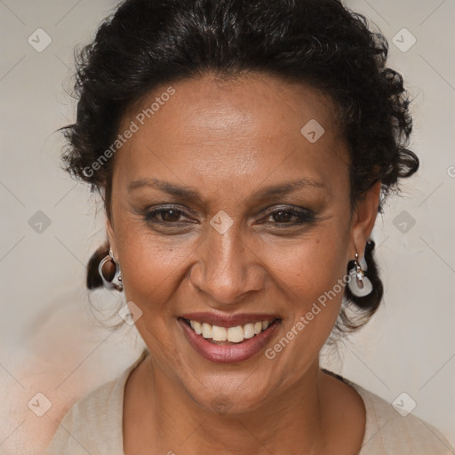 Joyful black adult female with medium  brown hair and brown eyes