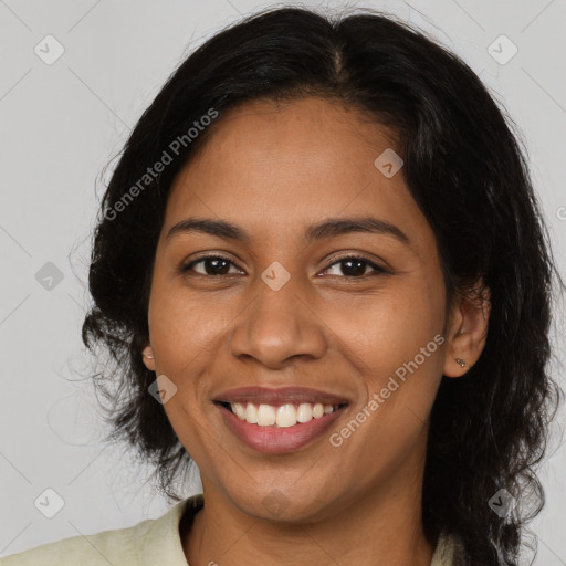 Joyful latino young-adult female with long  brown hair and brown eyes