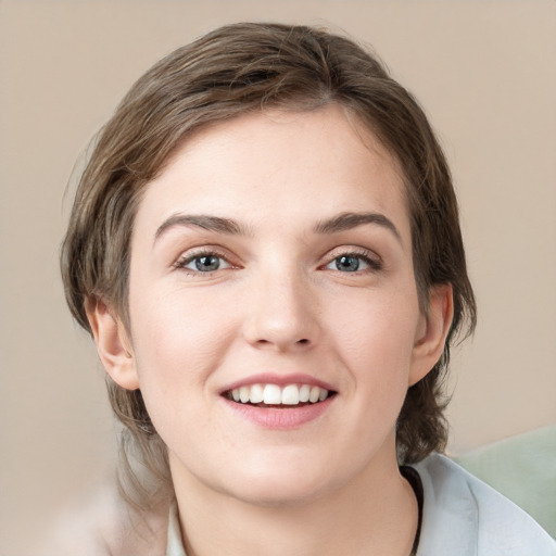 Joyful white young-adult female with medium  brown hair and grey eyes