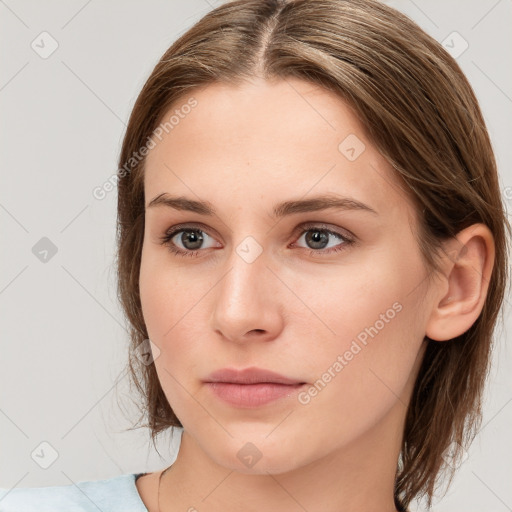 Neutral white young-adult female with medium  brown hair and brown eyes