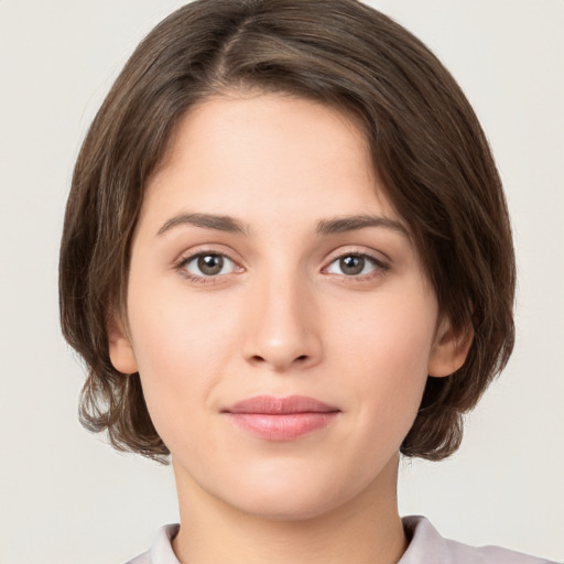 Neutral white young-adult female with medium  brown hair and brown eyes