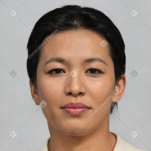 Joyful asian young-adult female with short  black hair and brown eyes