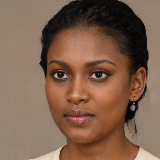 Neutral black young-adult female with medium  black hair and brown eyes