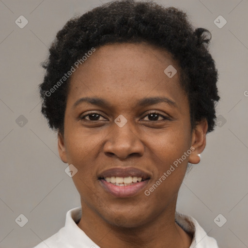 Joyful black young-adult female with short  black hair and brown eyes