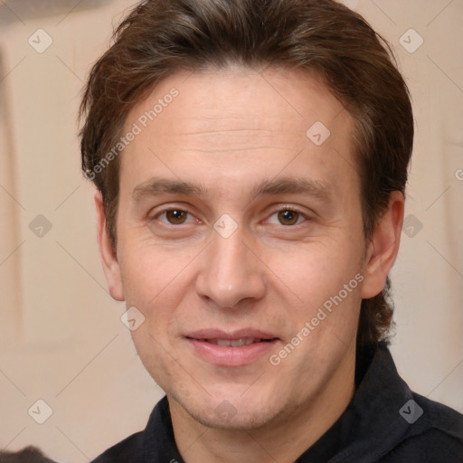 Joyful white adult male with short  brown hair and brown eyes