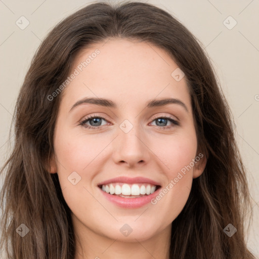 Joyful white young-adult female with long  brown hair and green eyes