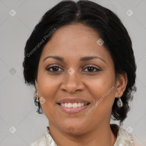 Joyful black adult female with medium  brown hair and brown eyes