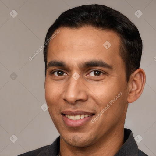 Joyful white young-adult male with short  black hair and brown eyes