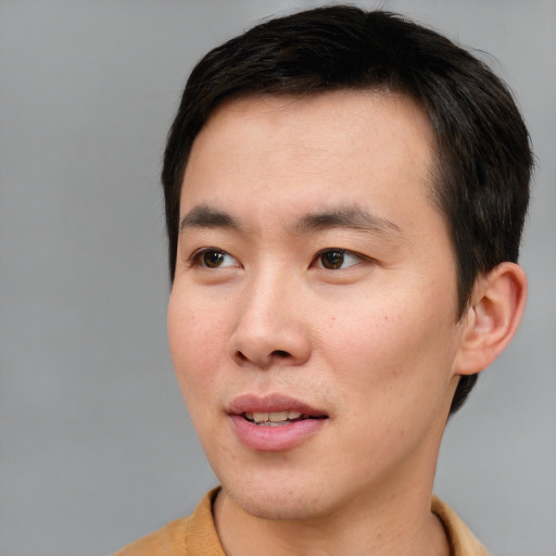 Neutral asian young-adult male with short  brown hair and brown eyes