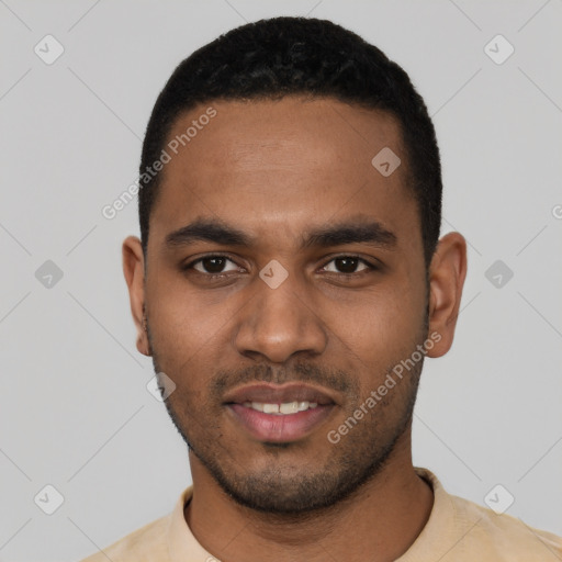 Joyful black young-adult male with short  black hair and brown eyes