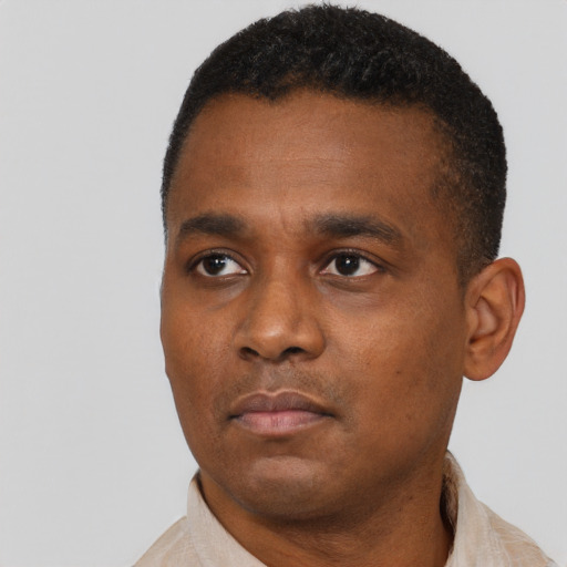 Neutral black young-adult male with short  black hair and brown eyes