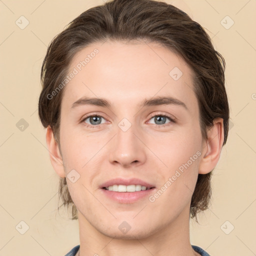 Joyful white young-adult female with medium  brown hair and grey eyes