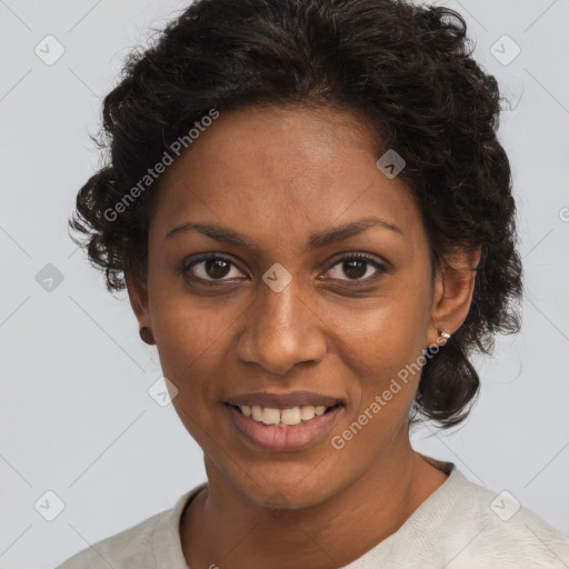 Joyful black adult female with medium  brown hair and brown eyes