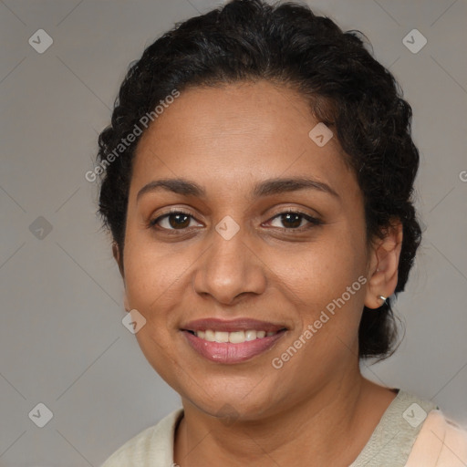 Joyful latino young-adult female with short  brown hair and brown eyes