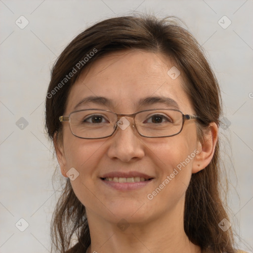 Joyful white adult female with medium  brown hair and brown eyes