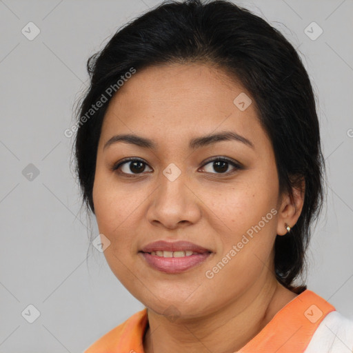 Joyful latino young-adult female with medium  brown hair and brown eyes