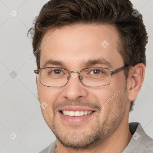 Joyful white adult male with short  brown hair and brown eyes