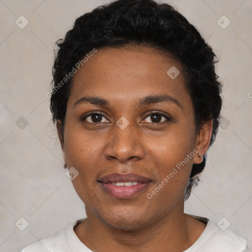 Joyful black young-adult female with short  black hair and brown eyes