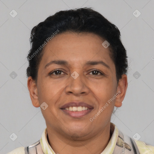 Joyful latino adult female with short  black hair and brown eyes