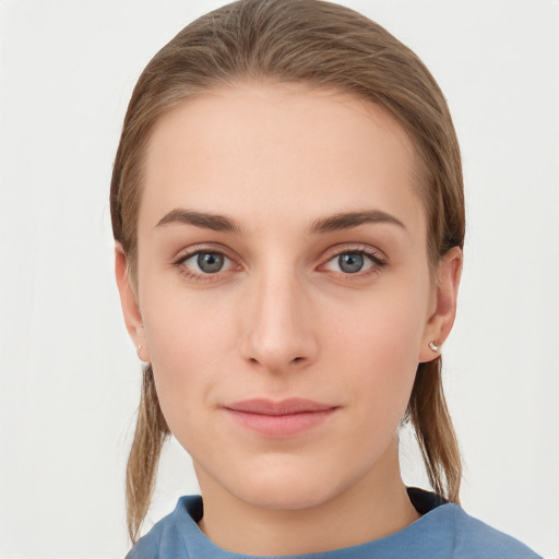 Neutral white young-adult female with medium  brown hair and grey eyes