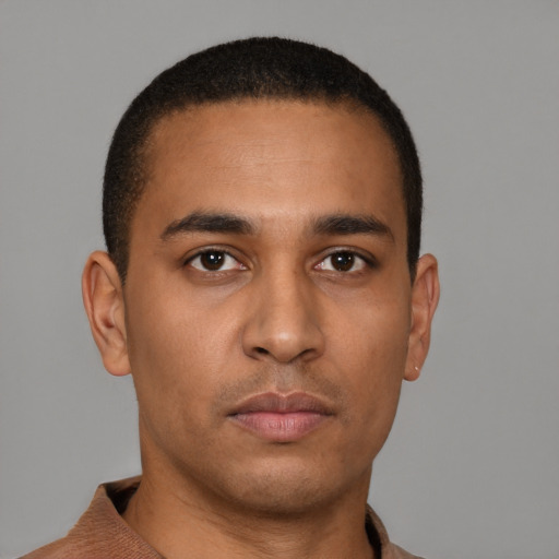 Neutral latino young-adult male with short  brown hair and brown eyes