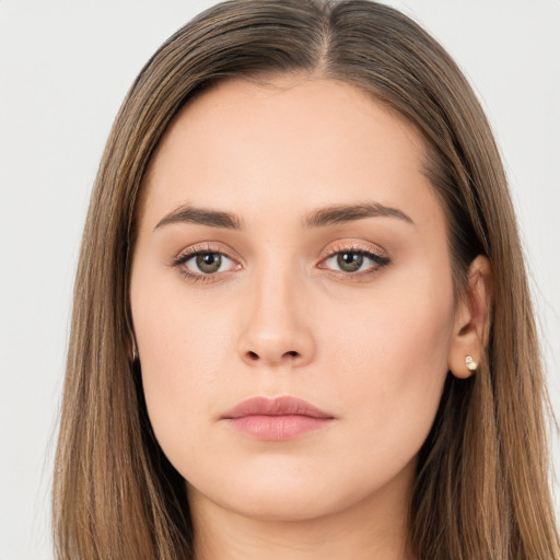 Neutral white young-adult female with long  brown hair and brown eyes