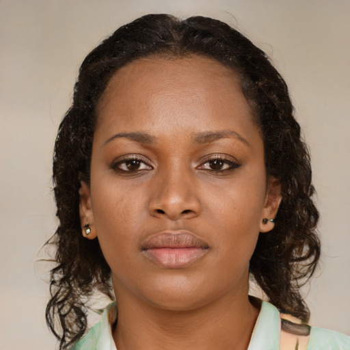 Neutral black young-adult female with medium  brown hair and brown eyes