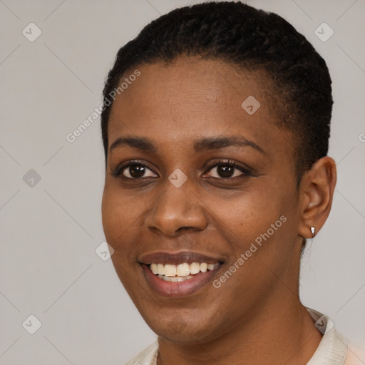 Joyful black young-adult female with short  black hair and brown eyes