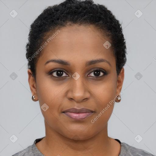 Joyful black young-adult female with short  black hair and brown eyes