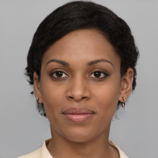 Joyful black young-adult female with medium  black hair and brown eyes