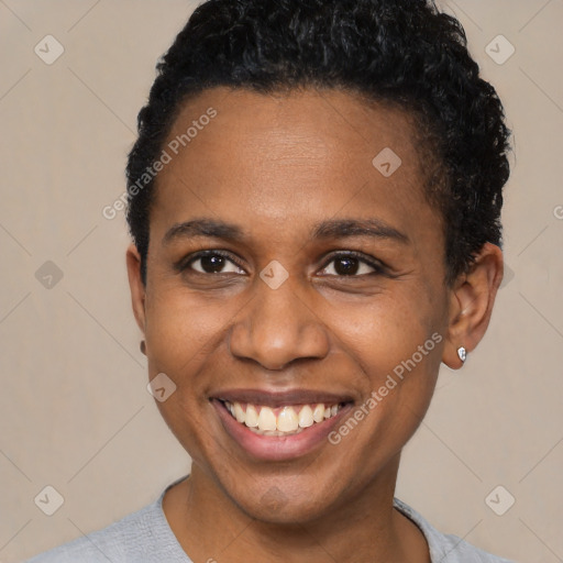 Joyful black young-adult male with short  brown hair and brown eyes