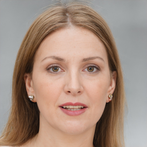 Joyful white adult female with long  brown hair and brown eyes