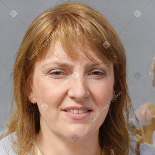 Joyful white adult female with medium  brown hair and blue eyes