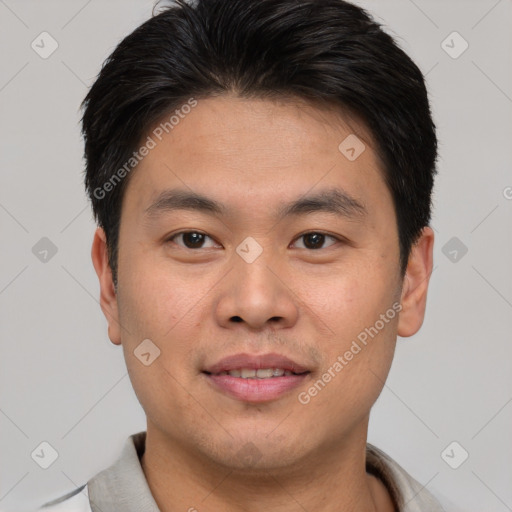 Joyful asian young-adult male with short  brown hair and brown eyes