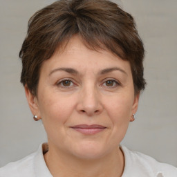 Joyful white adult female with short  brown hair and brown eyes