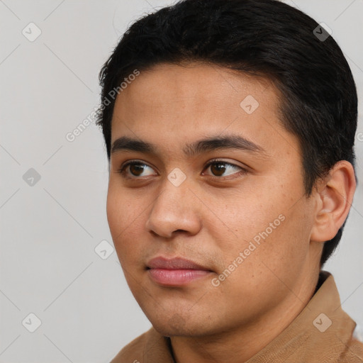 Joyful asian young-adult male with short  brown hair and brown eyes