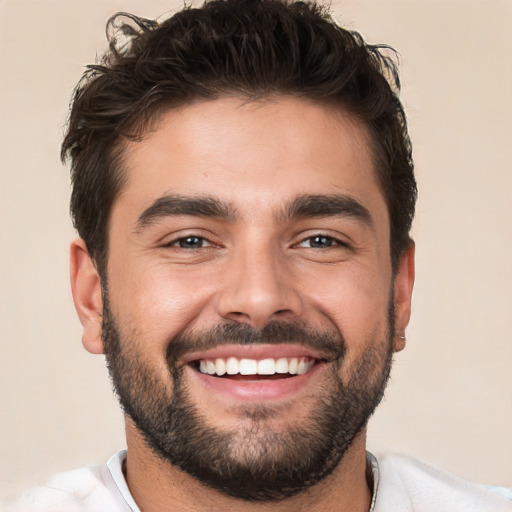 Joyful white young-adult male with short  black hair and brown eyes