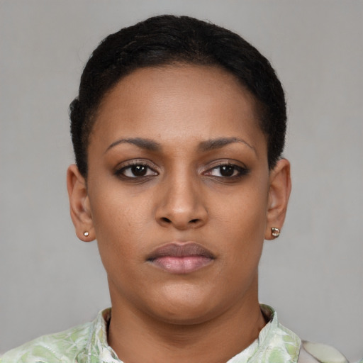 Neutral latino young-adult female with short  brown hair and brown eyes