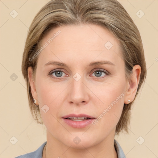 Joyful white young-adult female with medium  brown hair and blue eyes