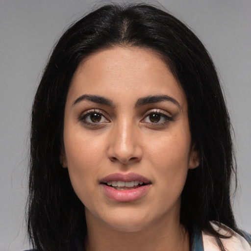 Joyful latino young-adult female with medium  black hair and brown eyes