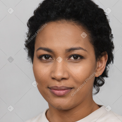 Joyful latino young-adult female with short  black hair and brown eyes