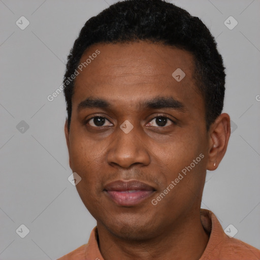 Joyful black young-adult male with short  black hair and brown eyes