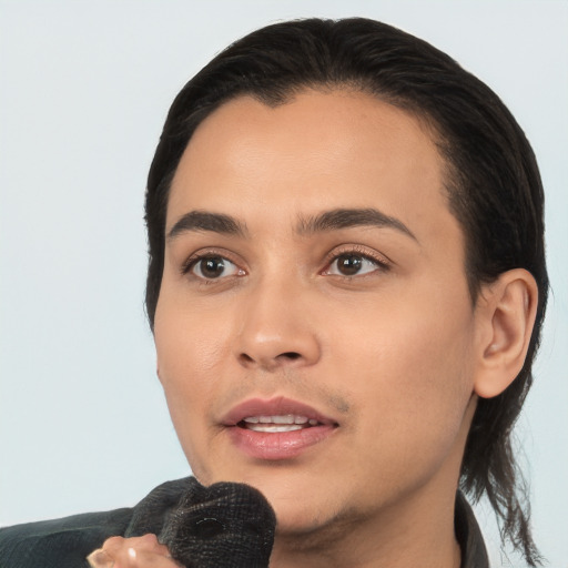 Joyful white young-adult female with short  black hair and brown eyes