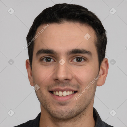 Joyful white young-adult male with short  black hair and brown eyes