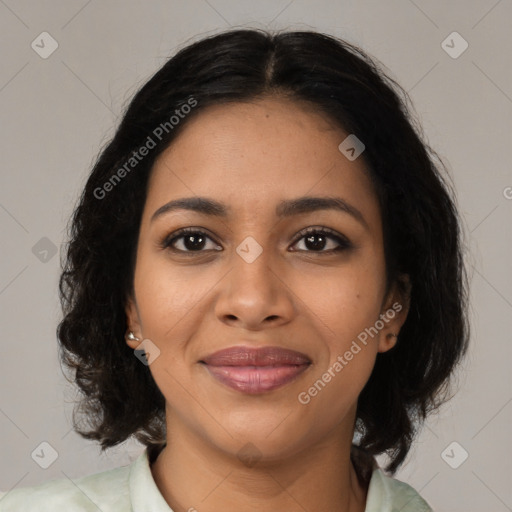 Joyful black young-adult female with medium  brown hair and brown eyes