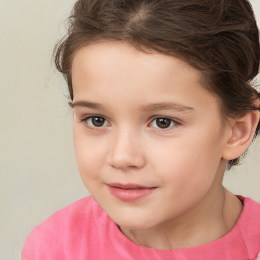 Joyful white child female with short  brown hair and brown eyes