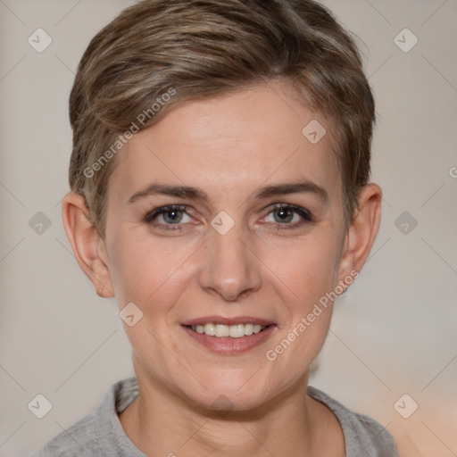 Joyful white young-adult female with short  brown hair and grey eyes