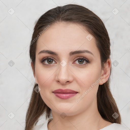 Joyful white young-adult female with medium  brown hair and grey eyes