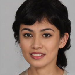 Joyful asian young-adult female with medium  black hair and brown eyes